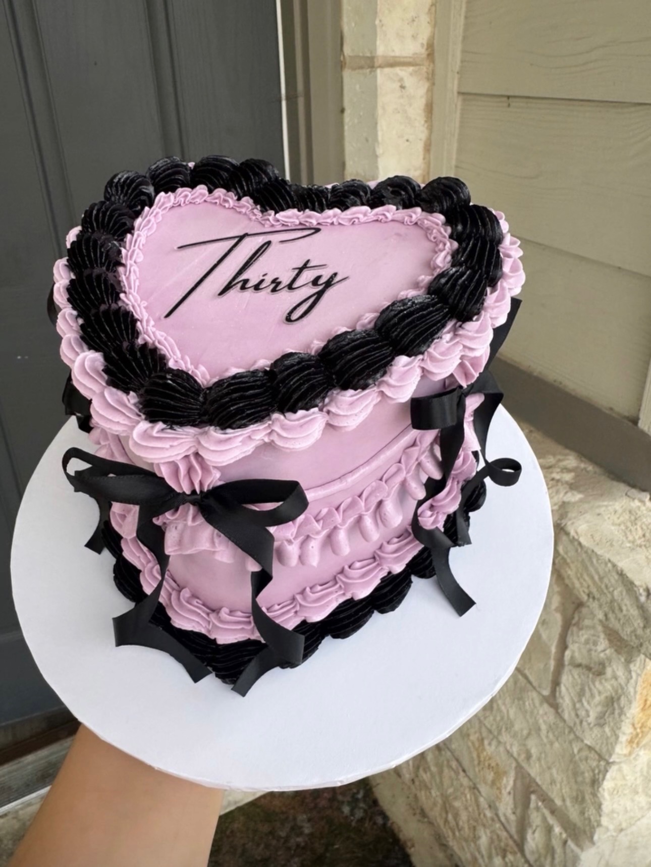 Pink heart-shaped birthday cake