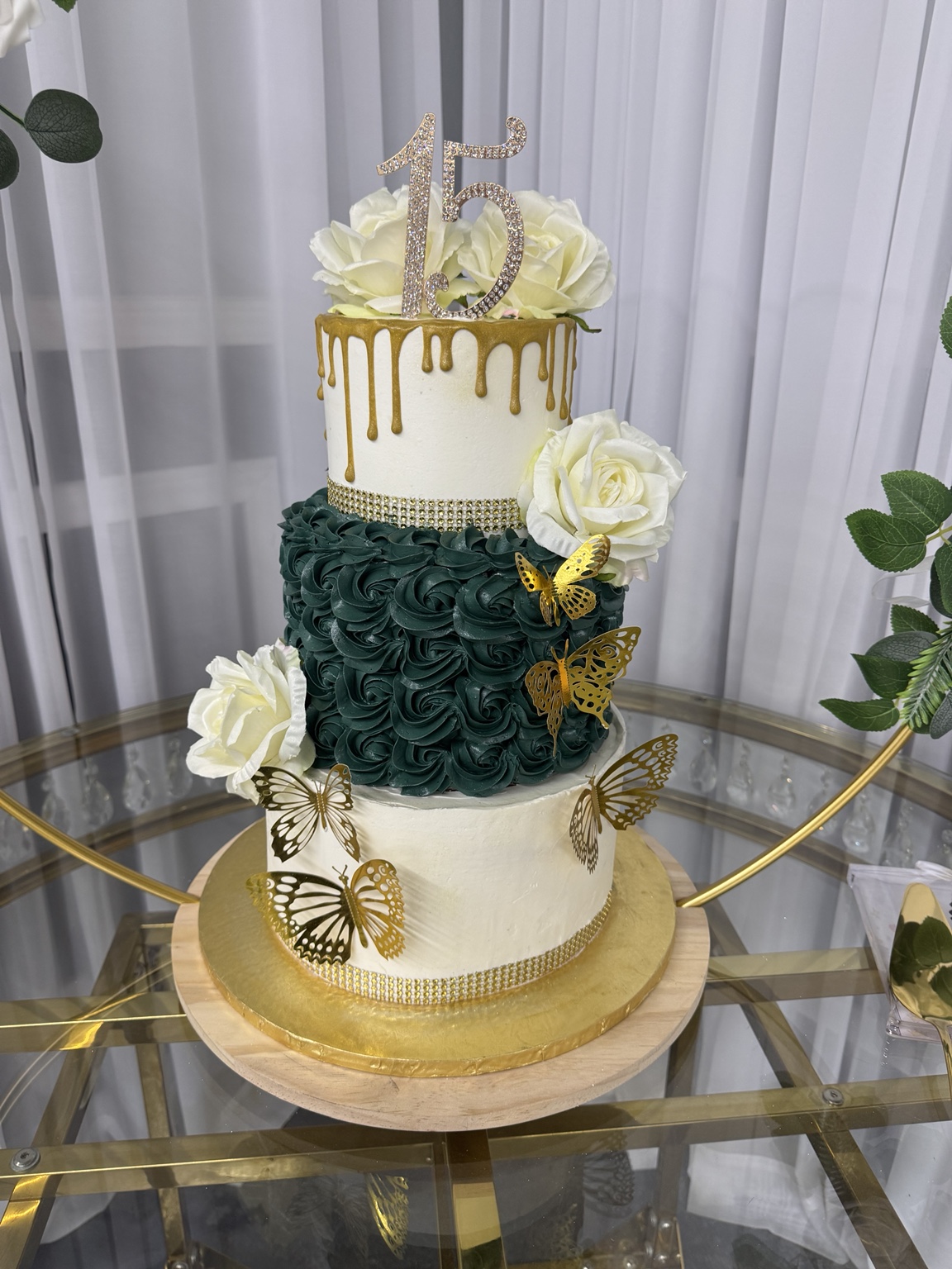Quinceañera cake with gold butterflies